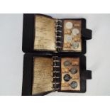 Two Harry Potter coin collections, each contained in Gringotts Savings Book wallet.