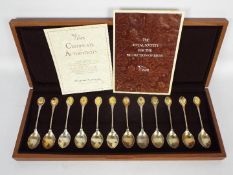 A cased Royal Society for the Protection of Birds spoon collection comprising twelve silver spoons