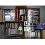 Five boxes of various compact discs.