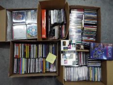 Five boxes of various compact discs.