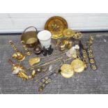 A collection of metalware, predominantly brass to include safety lamp, horse brasses and similar.