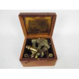 A brass nautical sextant marked 'Kelvin & Hughes, London 1917', contained in fitted box.