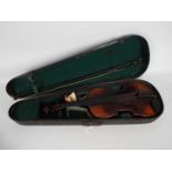 A vintage violin, no label to the interior, approximately 59 cm (l),
