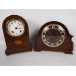 Two mantel clocks comprising a dome top example with Ansonia Clock Co movement and a Guta example.