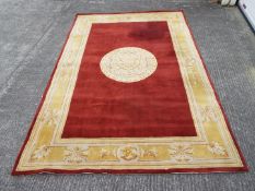 A Chinese wool carpet measuring approximately 180 cm x 275 cm.