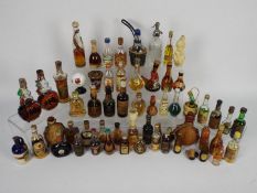 A collection of vintage miniatures to include whisky, rum, port, liquors and similar.