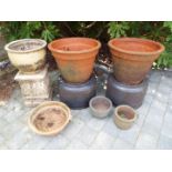 A selection of garden stoneware to include two matched large terracotta pots,