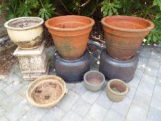 A selection of garden stoneware to include two matched large terracotta pots,