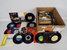 A collection of 7" vinyl records to include The Kinks, The Rolling Stones, The Beatles, Duran Duran,