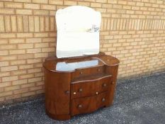 A dressing table with mirror,