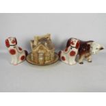 Lot to include a cheese dome in the form of houses, fireside dogs and a model of a bull.