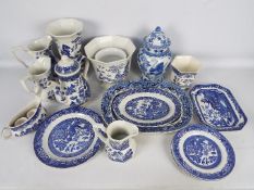 A collection of blue and white ceramics to include plates, jugs, vases and similar.