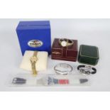 A collection of wrist watches to include Swatch, Rotary, Gucci and similar, part boxed.