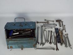 A mechanics metal tool box to include numerous ring and open-ended spanners and similar.