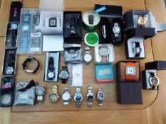 Designer Watches - a job lot of 23 watches to include Storm, Boss, Fossil, Hard Rock Cafe,