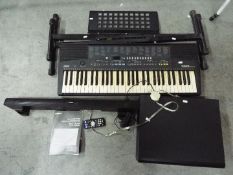 A Yamaha home theatre system, model YHT-S400 and a Yamaha keyboard PSR-210 with stand.