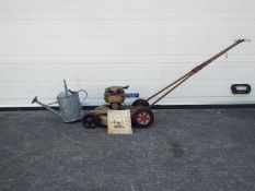 A gardening lot to include a lawn boy 1958 model 7150 21 inch lawn mower with manual and a