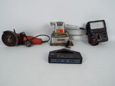 A mixed lot of tools to include an orbital sander, angle grinder, multi-meter and cable finder.