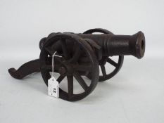 A cast iron model of a cannon,