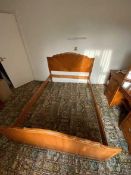 A wooden double bed frame (dismantled fo