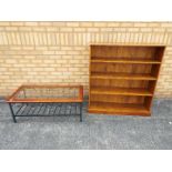 A freestanding open bookcase measuring approximately 116 cm x 110 cm x 30 cm and a glass topped