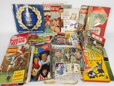 Football Items. A large box containing trade cards, newspapers, magazines, books, tickets etc.