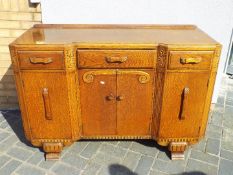 A sideboard with carved decoration measu