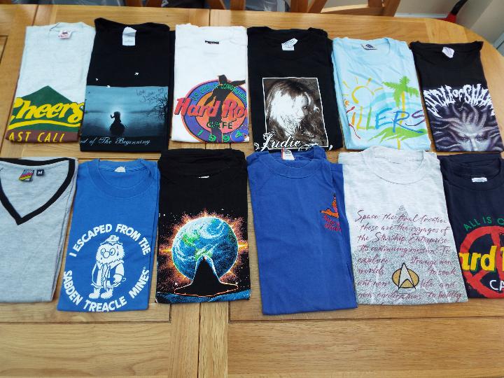 A job lot of 12 Tee shirts, various to include Hard Rock Café, etc, sizes M L and XL,