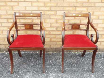 A pair of mahogany armchairs with inlaid