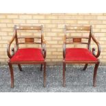 A pair of mahogany armchairs with inlaid