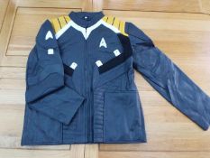 A black faux leather zip front jacket with yellow and white panels, size L,
