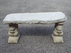 Garden Stoneware - A reconstituted stone bench with timber effect seat on squirrel form plinths