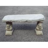 Garden Stoneware - A reconstituted stone bench with timber effect seat on squirrel form plinths