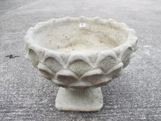 Garden Stoneware - A reconstituted stone pineapple pattern planter on circular base.