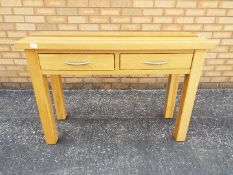 A console table measuring approximately 75 cm x 110 cm x 40.