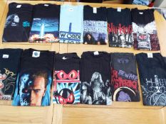 A job lot of 12 various tee shirts, predominantly pictorial images on black, sizes M, L and XL,