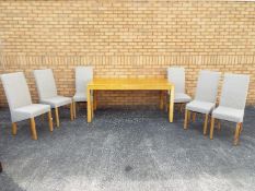 A rectangular dining table with six chairs, table approximately 70 cm x 170 cm x 90 cm.