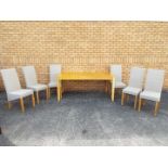 A rectangular dining table with six chairs, table approximately 70 cm x 170 cm x 90 cm.