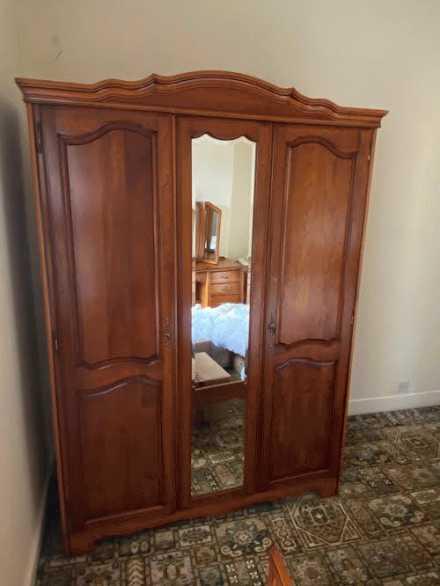 A triple wardrobe with external mirror t