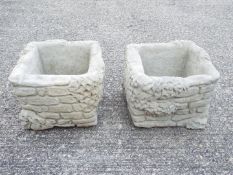 Garden Stoneware - A pair of reconstituted stone planters with ivy decoration.