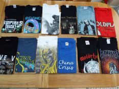 A job lot of 12 Tee shirts, all with reference to touring name bands, etc, sizes M and L,