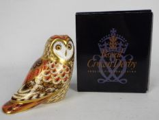 Royal Crown Derby - A boxed 2008 Collectors Guild exclusive paperweight Short Eared Owl with gold