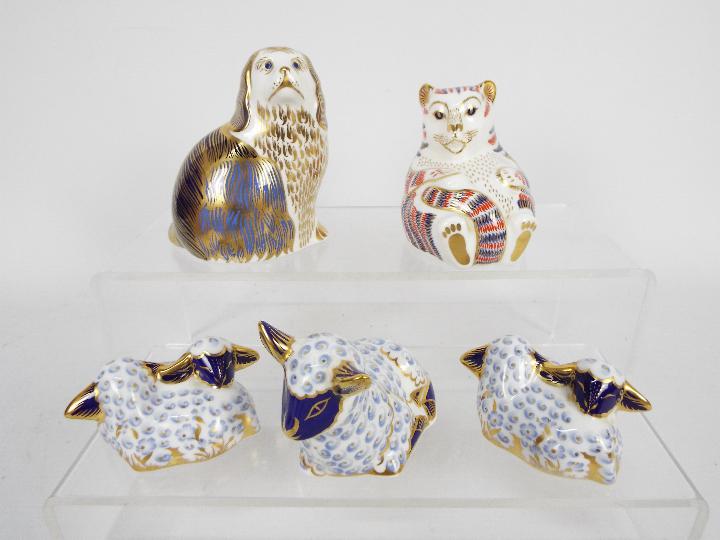 Royal Crown Derby - A collection of paperweights, all with silver stoppers to include a Spaniel,