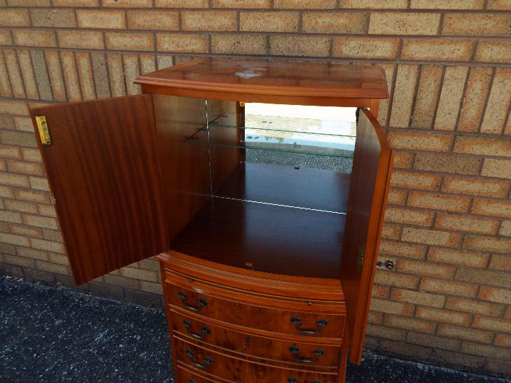 A tallboy cupboard over chest with twin door upper section over four drawers, - Image 3 of 4