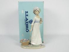 Lladro - A boxed figurine #5030 Wild Flower, approximately 28 cm (h).