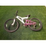 Mountain Bike - a white and hot pink Muddy Fox Recoil 24 mountain bike with 24" wheels,