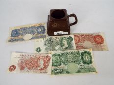 Banknotes - A WW2 issue £1 note, K Peppiatt, a series A £1 note, L K O'Brien, a series C £1 note,