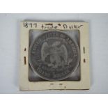 Silver coin - An 1877 US Trade Dollar, San Francisco mint.