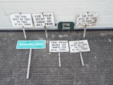 Seven metal golf-course signs which show rules and locations. Lot includes a 'Drop Zone' golf sign.