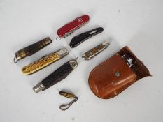 A small collection of folding knives and similar.